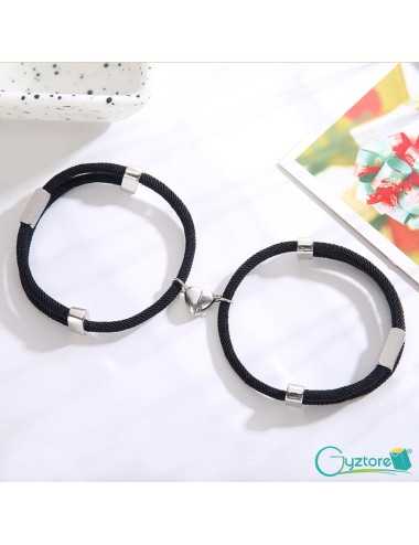 Pulseras negras con dije de...